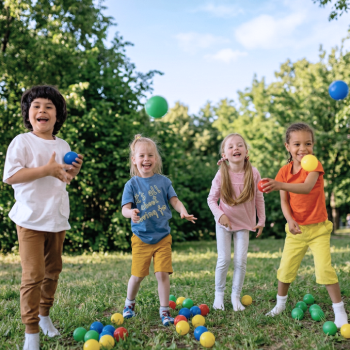 Children juggling outdoors